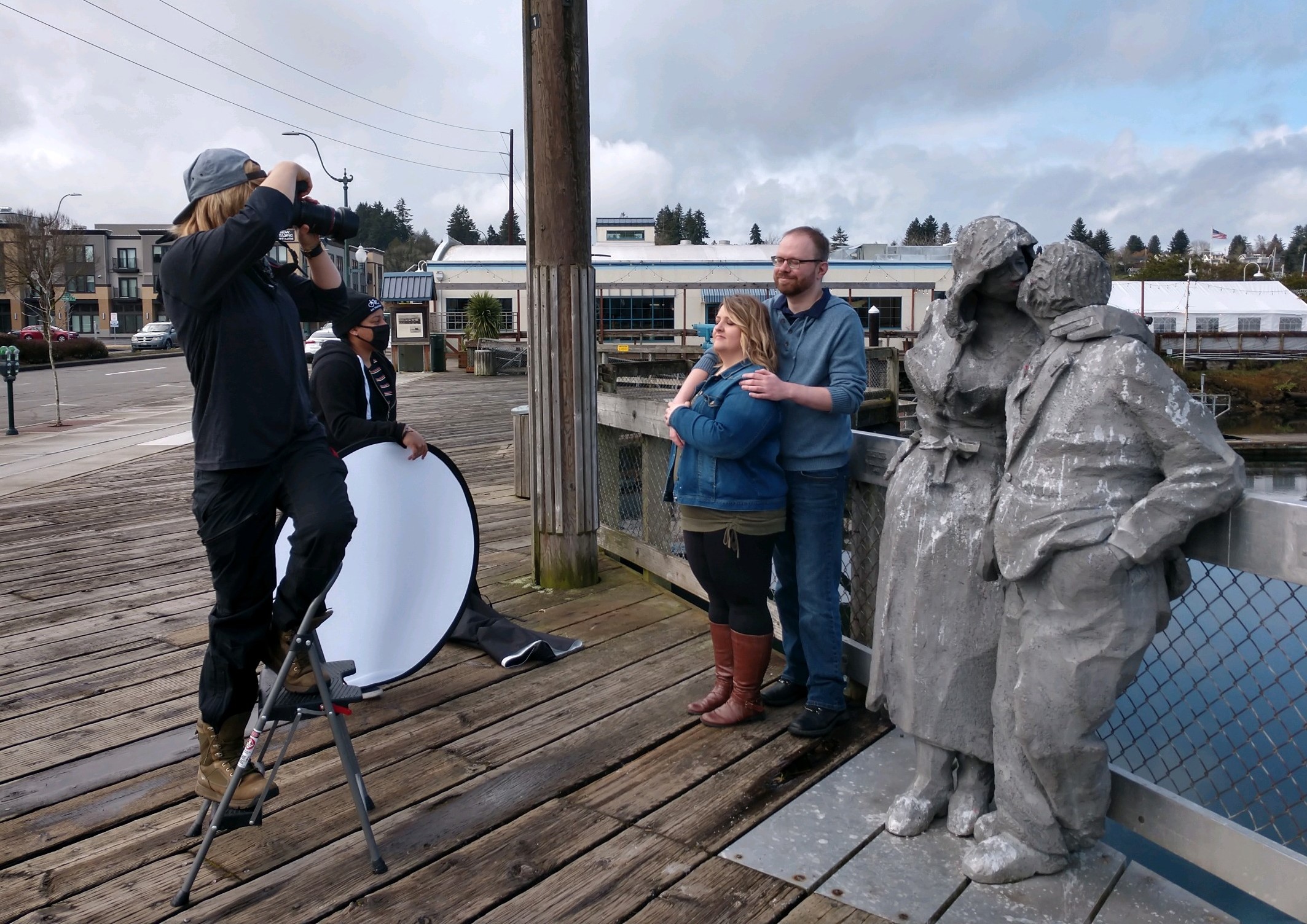 Kendra and assistants photographing a couple by the water